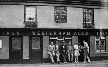 1930s enjoying a pint outside The Old House at Home