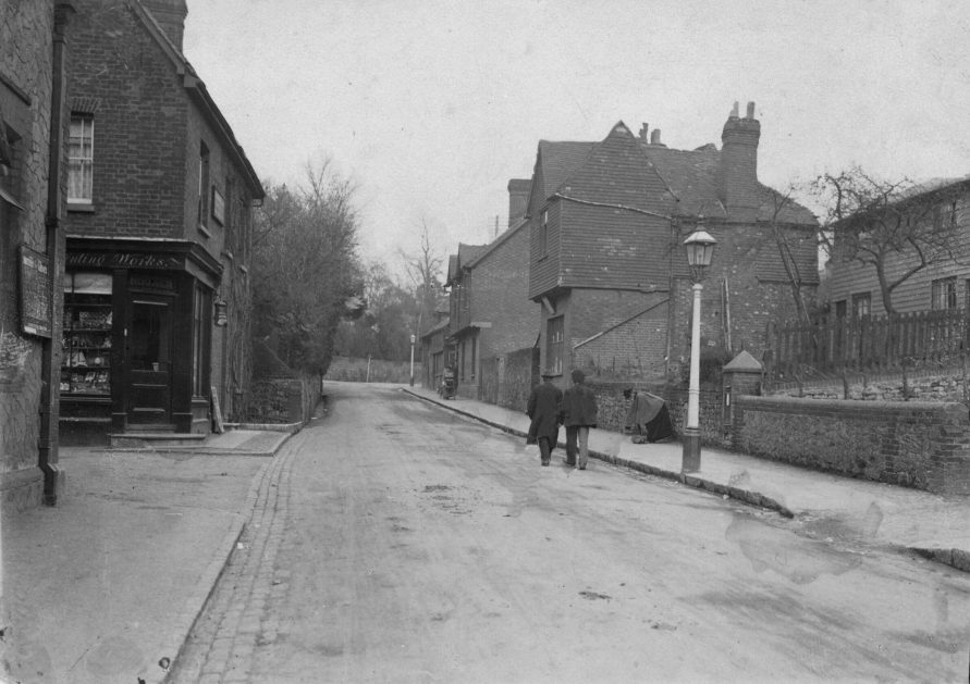 This unusual picture offers some rare detail. Unusual because the framing is strange - where was the eye being led and what was the story attempting to convey?   There is just enough of Charles Hooker's 'Herald Steam Printing Works' for us to determine what it was. On the right a view that cannot be seen today because of a scruffy, tall privet hedge, but circa 1904, the little white weatherboard 'Bank Cottages' can be clearly seen next door to the site of 'Park View Laundry'. Today the area contains a modern development called 'Wells Close' in memory of Beryl Wells who ran the last laundry on the site. At the time the photograph was taken, the Proprietors were William and Mary Wallace who lived at 'Bellview' in New Street, opposite Burgess' yard.  