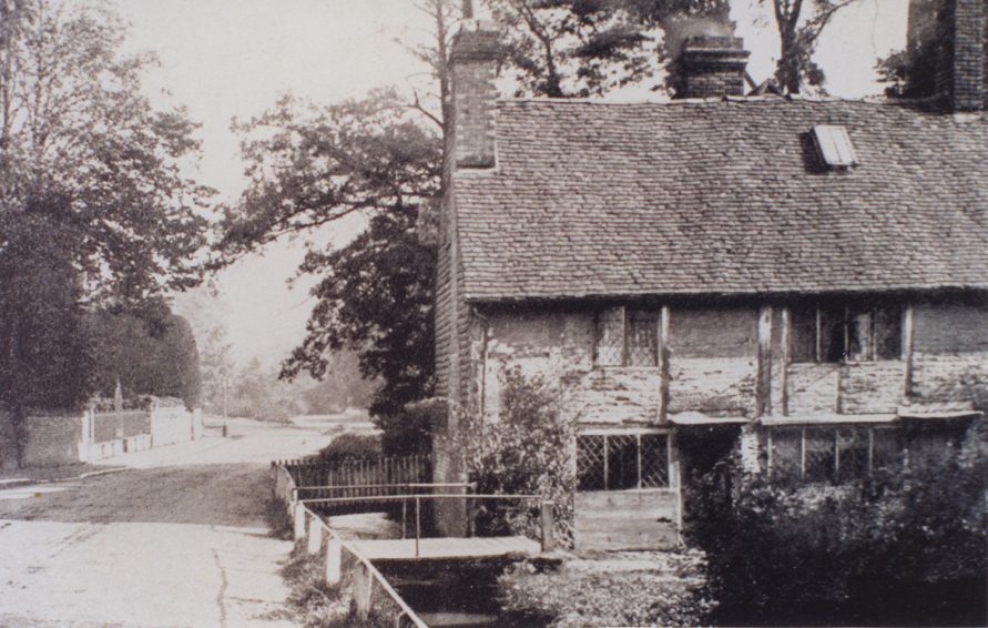 A closer shot of the end cottage of Springfields shows it to be timber framed with brick in-fill and of considerable antiquity.